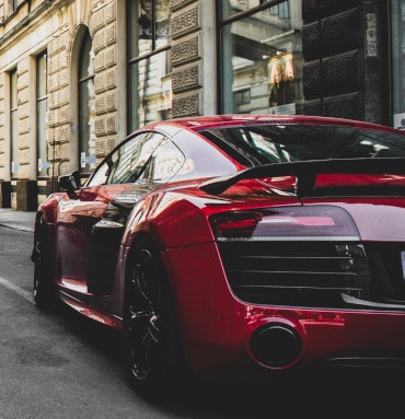 red car in old city