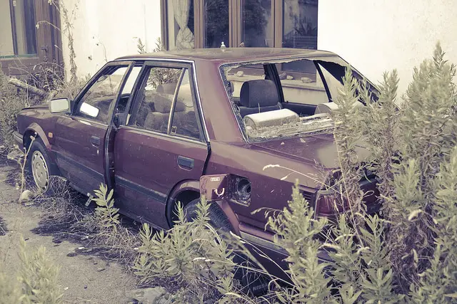 abandoned car in yard