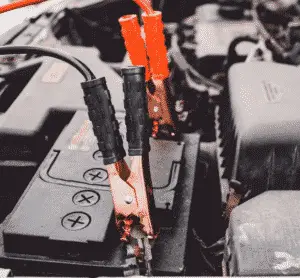 jumper cables on battery