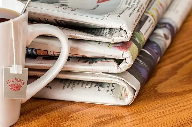 cleaning windows with newspaper