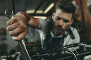 mechanic working on engine